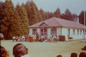 Committee in front of Kekedowigamig. Jean on committee