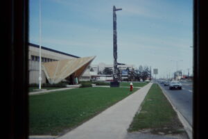 Totem pole in front of building