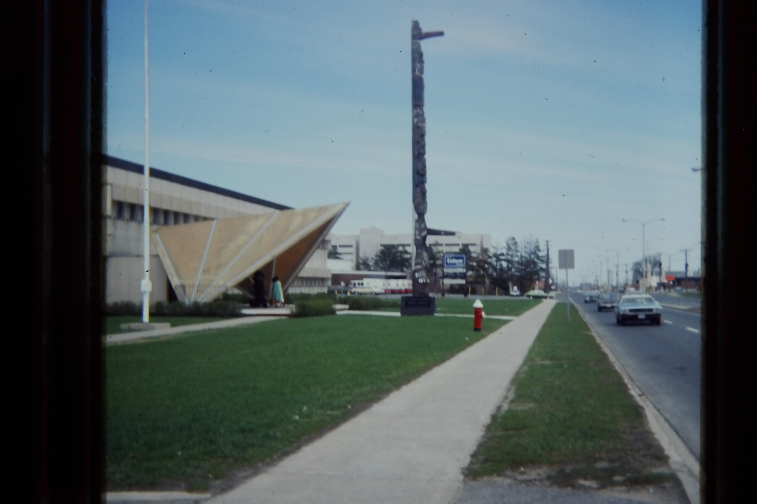 Totem pole in front of building