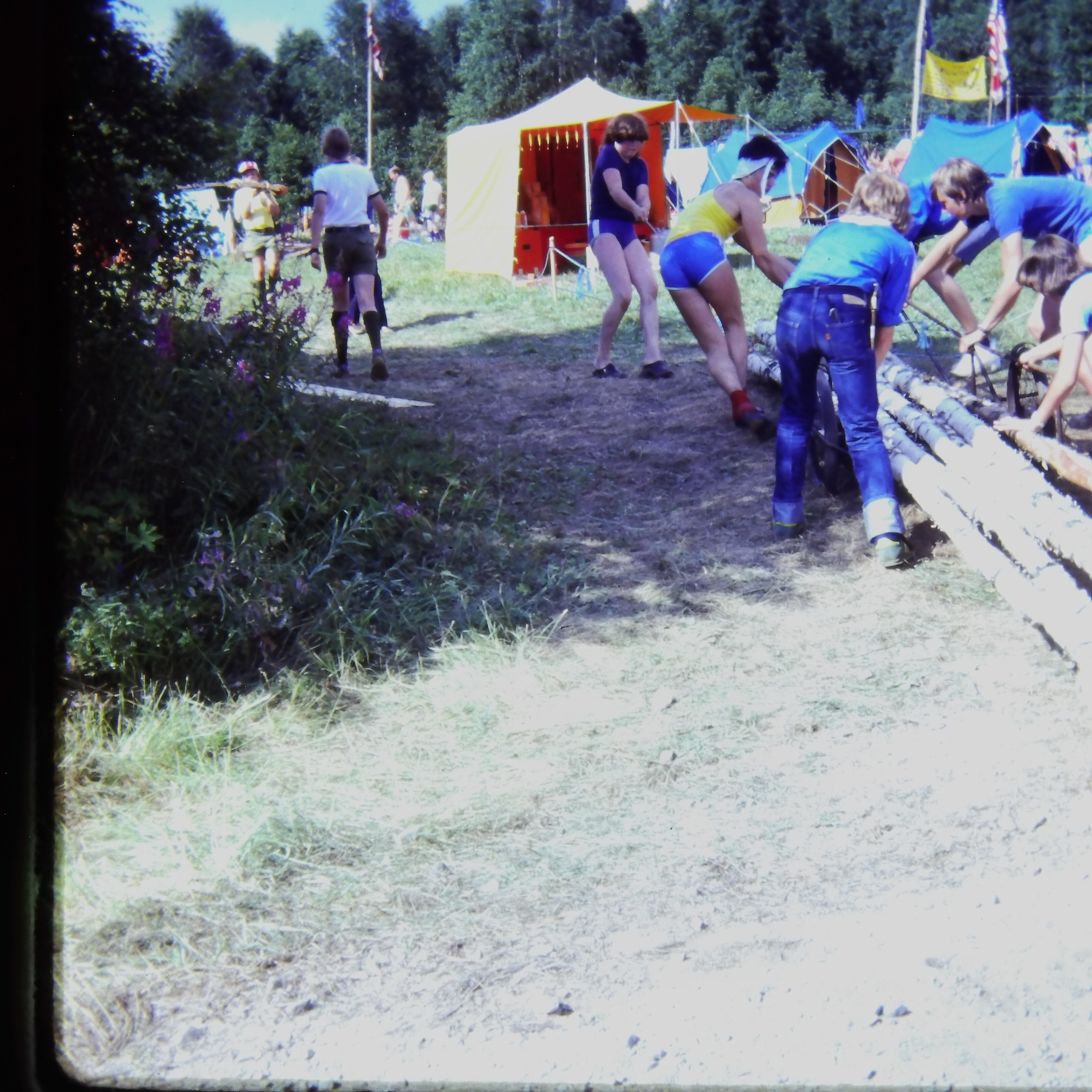 Scouts carrying logs for gate