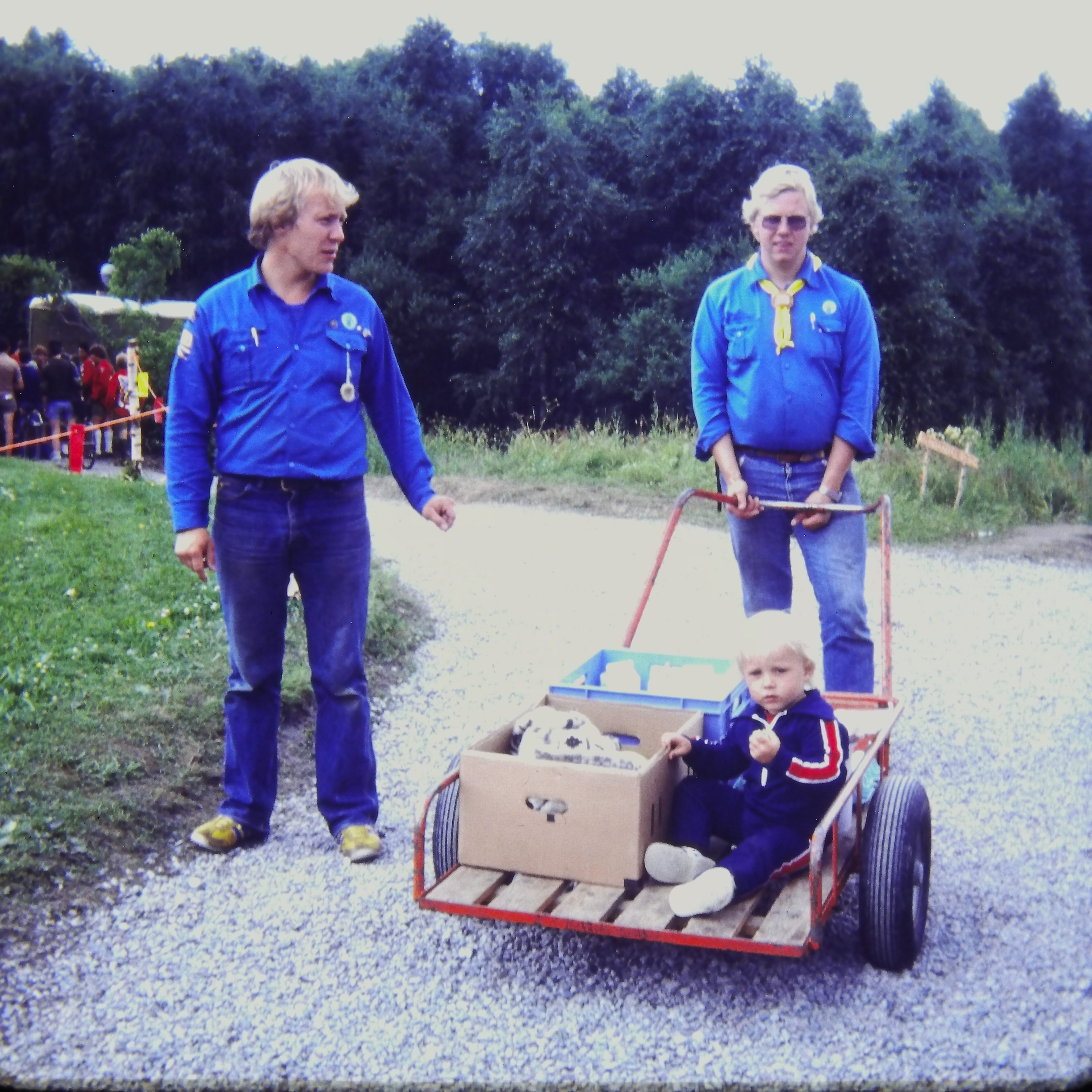 Supplies on cart with young boy